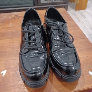 Healed black loafer style